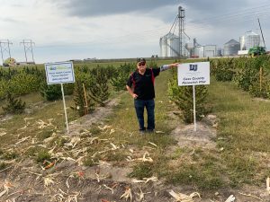 Bill in a hemp research plot at the Garden City research farm